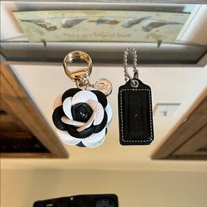Coach patent leather Black hang tag and White Flower Keychain